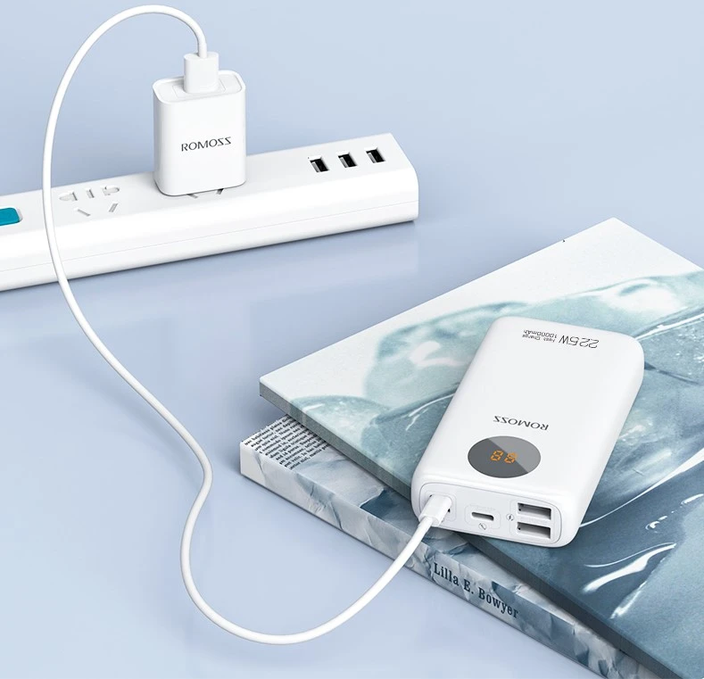 White power bank charging on a desk